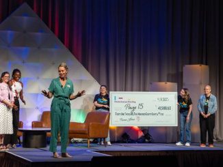 Woman speaking from stage