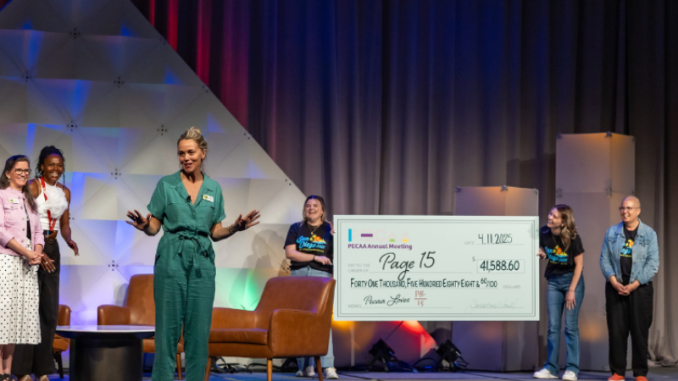 Woman speaking from stage